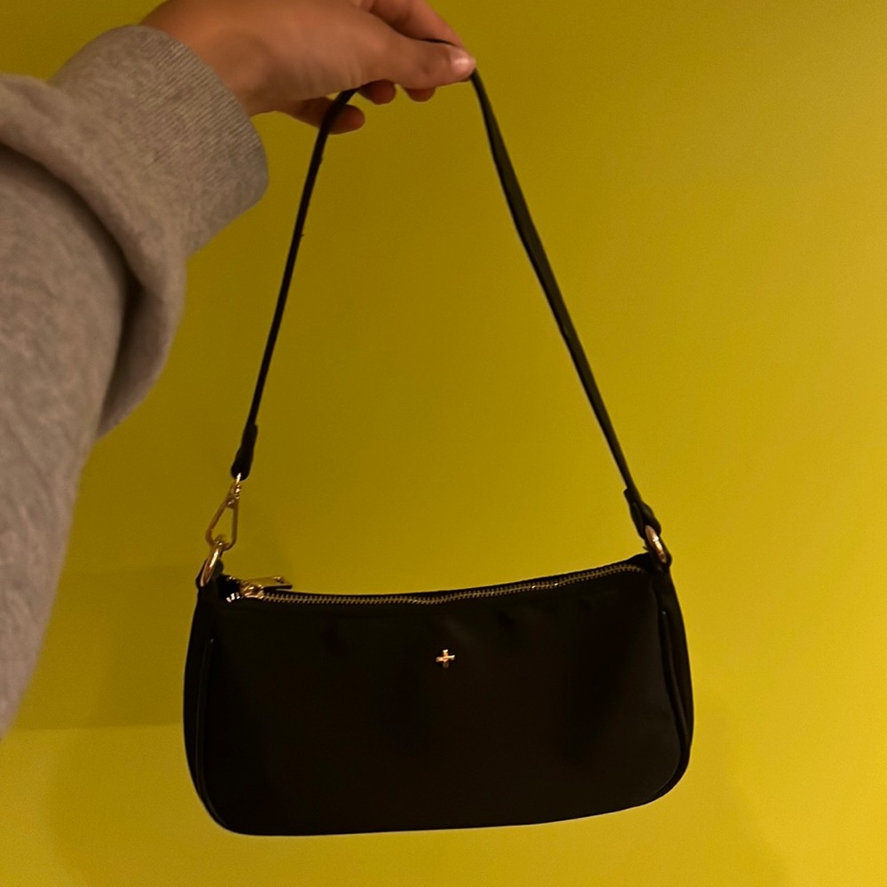 This item is a cute little shoulder bag which I purchased on an online website!
